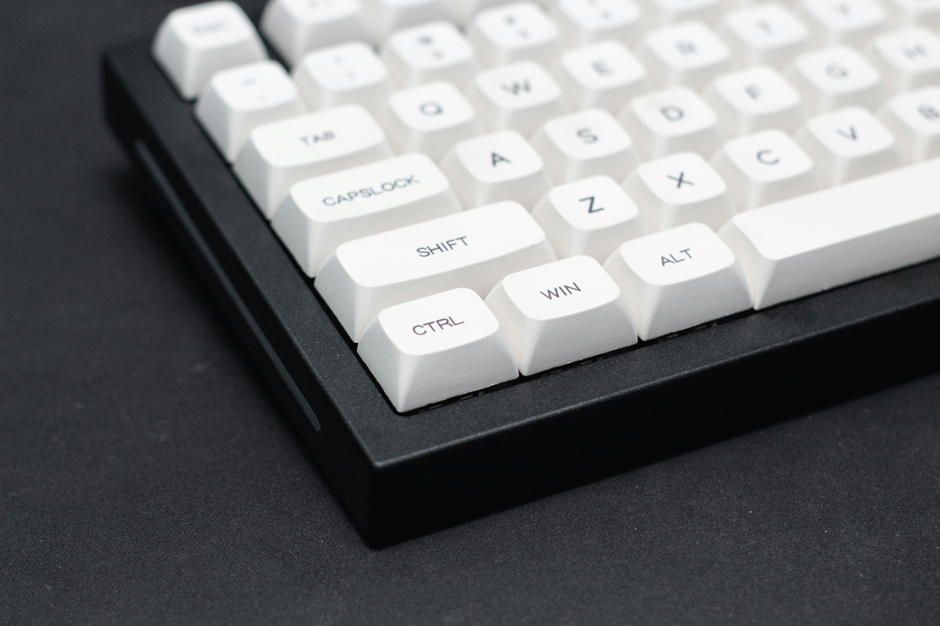 Professional developer keyboard with white keycaps representing custom software development, coding solutions, and enterprise application programming