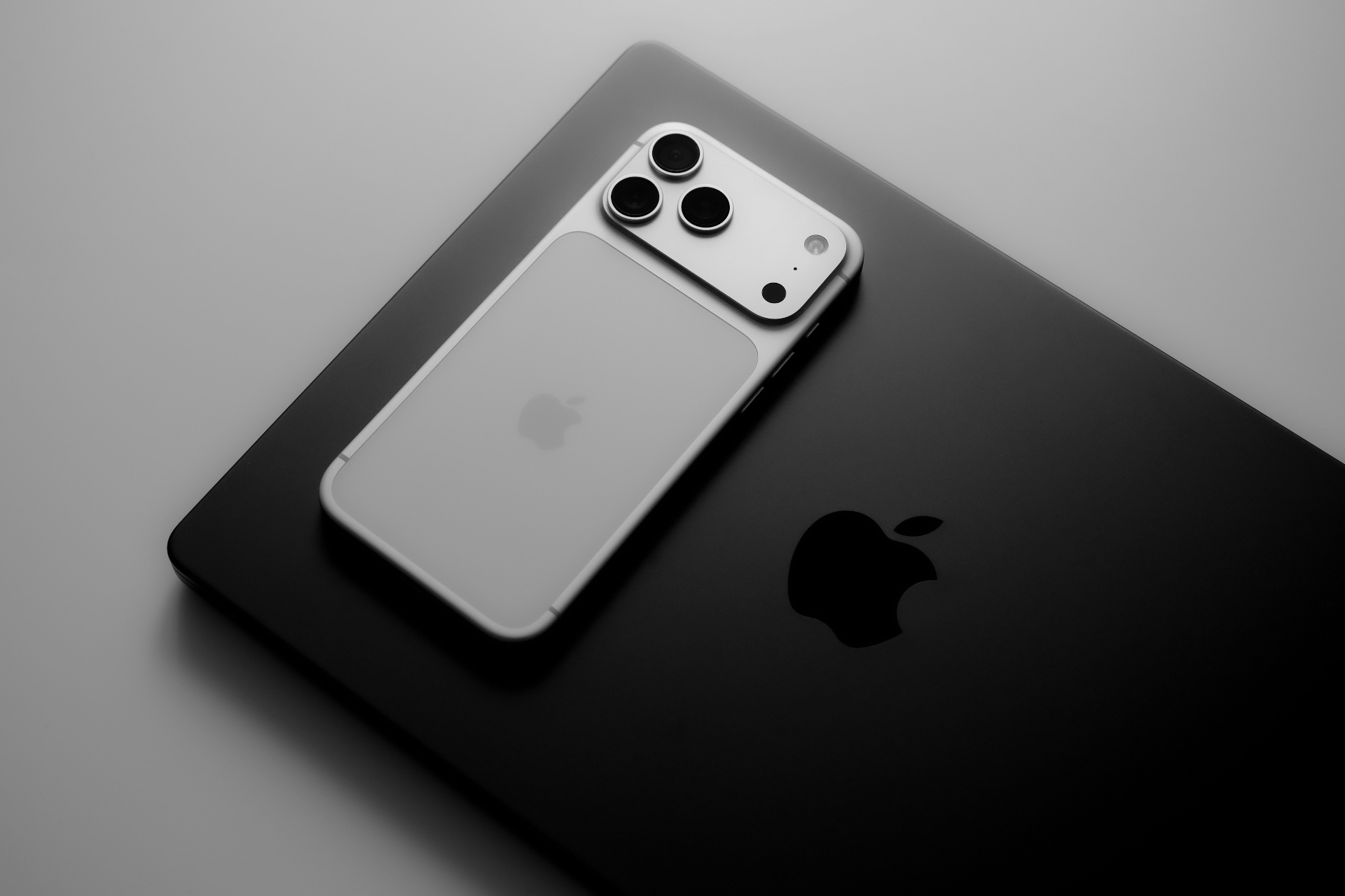 Modern Apple devices showcasing responsive web development and mobile-first design for business